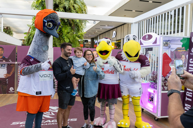 VoltX Energy mascot Eddie posing with a family and two Sea Eagles mascots at a Westfield Warringah Mall meet and greet